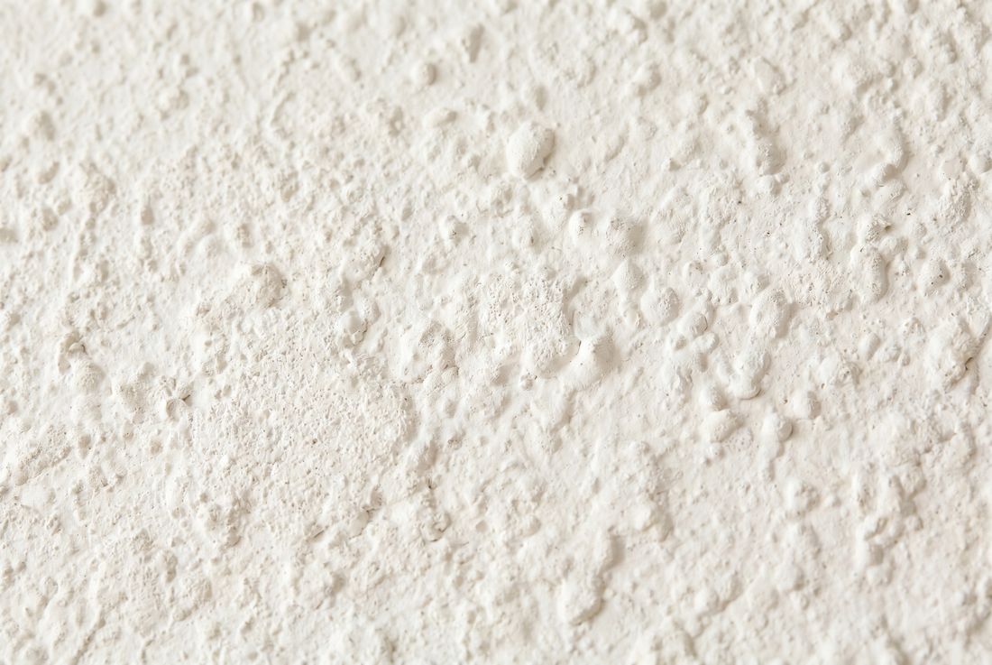 Close-up of vintage white popcorn ceiling texture &mdash; Aurora popcorn ceiling repair and removal